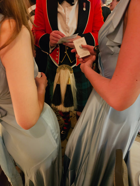 Army officer and ladies fill their dance cards
