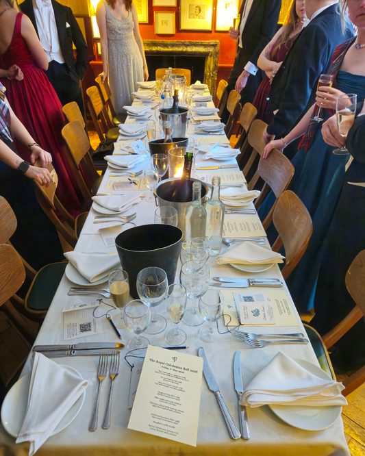 Guests in White Tie at dinner before a ball