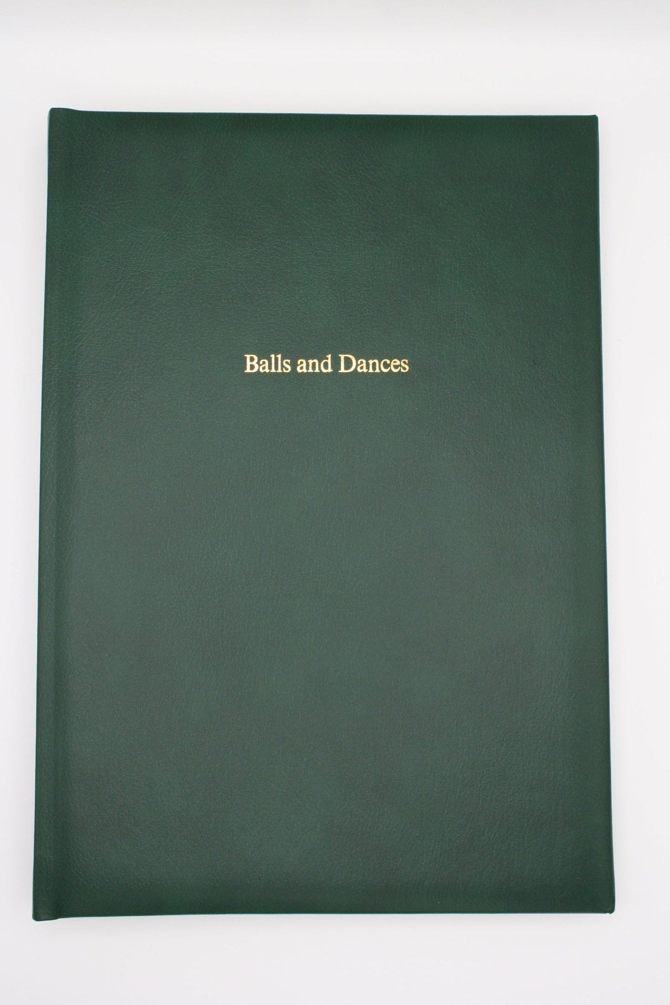 Green Ballroom Diary on white background with "balls and dances" embossed on the front.